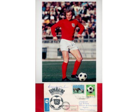 England Football Hero Bobby Moore Signed Espana '82 First Day Cover With Polish Stamps and postmarks. Includes a 10x8 inch Co