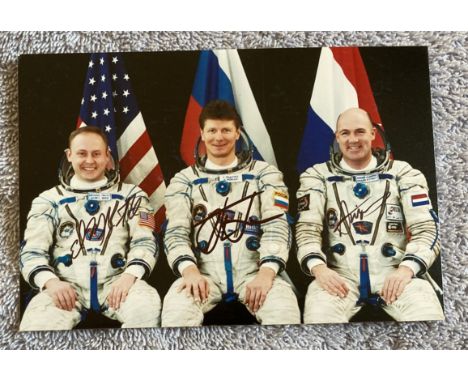 Space Cosmonauts Soyuz TMA-4 Crew Portrait signed By Whole Crew Michael Fincke, Gennady Padalka, Andre Kuipers. 6 x 4 colour 