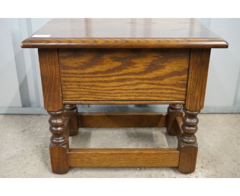 A carved-oak box stool, 46 x 31 x 38 cm high
