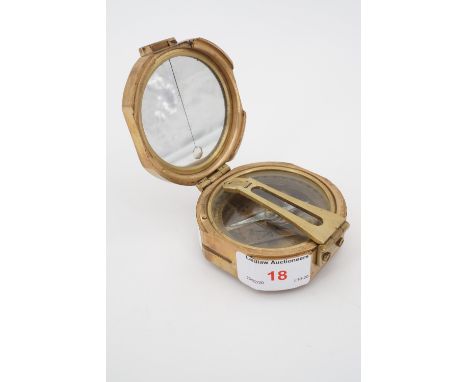 A reproduction brass compass