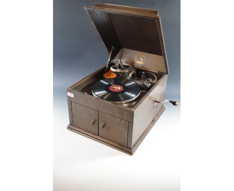 An HMV / His Masters Voice table model gramophone and a quantity of 78 rpm records.