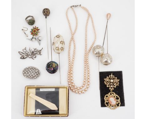 A quantity of vintage costume jewellery, including hat pins, brooches and a double strand necklace of faux pearls 