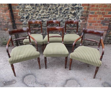 A set of six Regency brass inlaid mahogany dining chairs, with a tablet and rope-twist bar back and upholstered seat, on ring