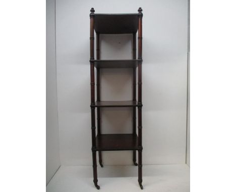 A Regency mahogany whatnot with four tiers and ring turned columns, on turned legs and castors, 51 1/2"h, 15"sq 