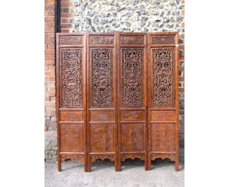 A 20th century Chinese elm four fold screen, with carved and pierced panels, decorated with animals, trees and clouds, each p