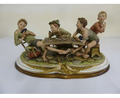 Capodimonte figurine of boys playing cards, The Cheat, signed to the base