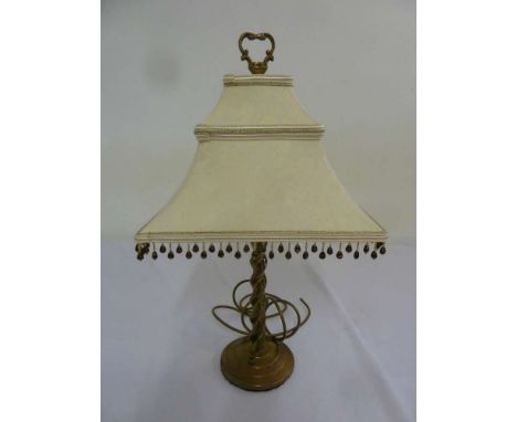 Brass table lamp on circular base with silk shade