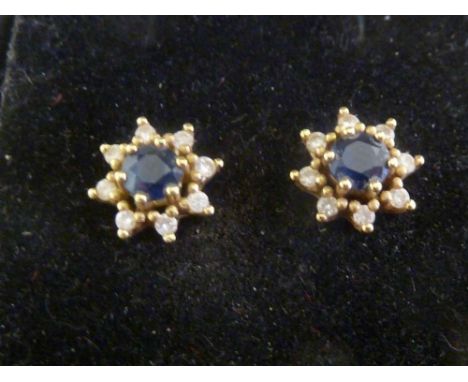 Pair of diamond and sapphire earrings set yellow gold