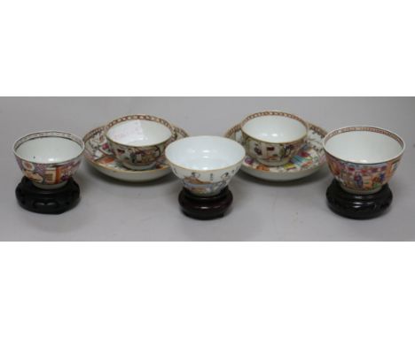 Three 18th century Chinese family rose tea bowls and two saucers, two other teabowls and three wood stands
