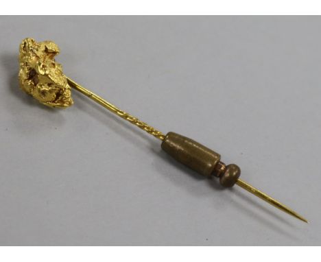 A Victorian yellow metal nugget stick pin, 64mm.