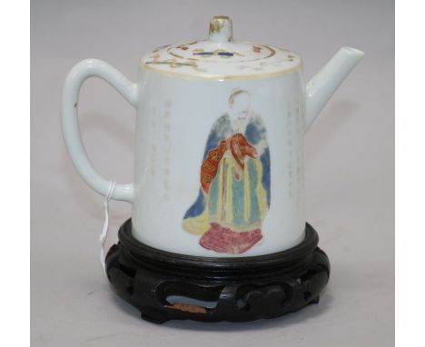 A Chinese famille rose teapot and cover, Daoguang period, wood stand teapot 11cm.