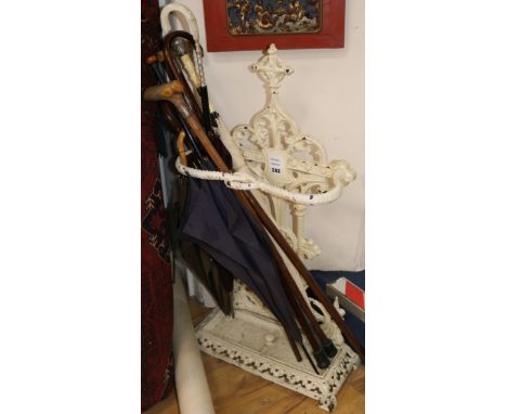 A Victorian white painted cast iron stick and umbrella stand