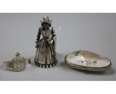 A Norwegian 830 standard silver napkin ring, a plated "Dutch girl" hand bell and a mounted shell purse.