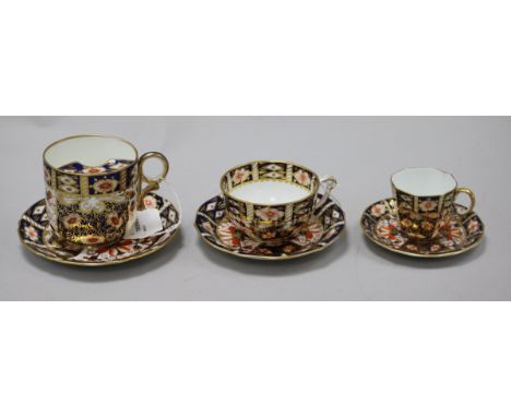 Three Royal Crown Derby cups and saucers