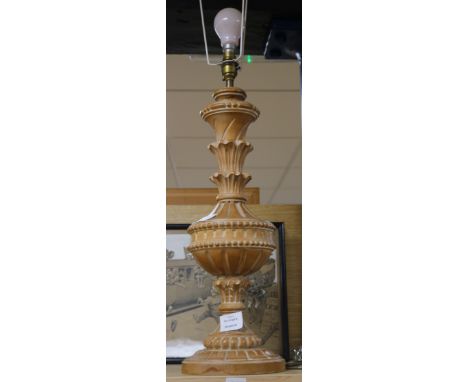 A carved pine table lamp