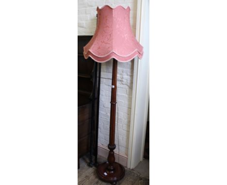 A turned mahogany standard lamp