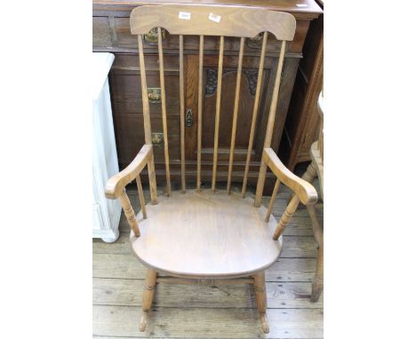 A 1920's beech Grandmother stick back rocking chair