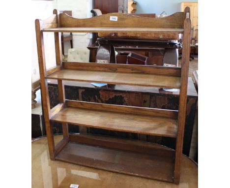 A three tier open oak shelf unit