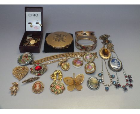 A COLLECTION OF MOSTLY VINTAGE COSTUME JEWELLERY, comprising a collection of brooches, two bangles, various style necklaces a