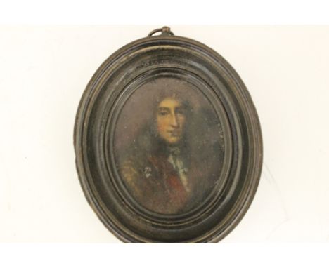 A LATE 17TH CENTURY MINIATURE, oval portrait of a classical gentleman, on copper, framed, 7.5 x 6 cm