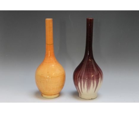 TWO 19TH CENTURY CHINESE MONOCHROME VASES, of globe and shaft form,comprising one with aubergine glaze, the other orange glaz