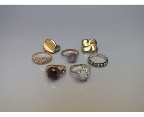 THREE 9CT GOLD LADIES DRESS RINGS, comprising an amethyst example, a garnet example and an opal and gemset example, together 