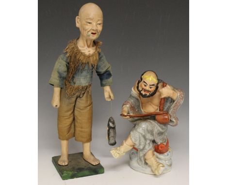 A CHINESE COMPOSITION FIGURE OF A FISHERMAN, together with a Japanese ceramic figure of a musician, tallest H 34.7 cm (2)