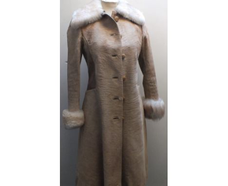 A STYLISH VINTAGE LADIES ZEBU FUR AND LEATHER COAT, sheepskin trim to to cuffs and collar, fully linedCondition Report:No obv