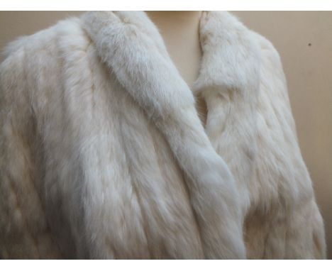 A LADIES VINTAGE CREAM FUR CAPE, fully lined, front hook fastening, together with a selection of vintage fur coats (4)