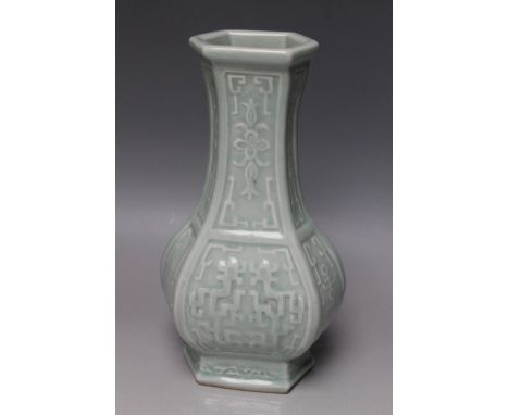 A CHINESE CELADON HEXAGONAL FORM BOTTLE VASE, with traditional scroll and lotus flower decoration, allover pale green glaze, 