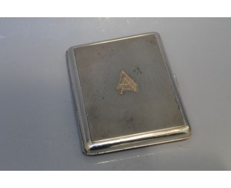 A HALLMARKED SWEDISH SILVER CIGARETTE CASE, having an engine turned design with interlinked AA initials in gold lettering to 
