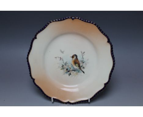 A ROYAL WORCESTER HAND PAINTED CABINET PLATE, central decoration depicting a bird with blossom and foliage, a second bird in 