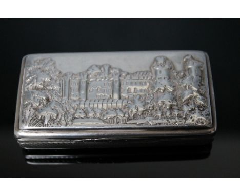 A HALLMARKED SILVER CASTLE TOP TYPE SNUFF BOX, the lid having a view of Windsor Castle, engine turned base with vacant cartou