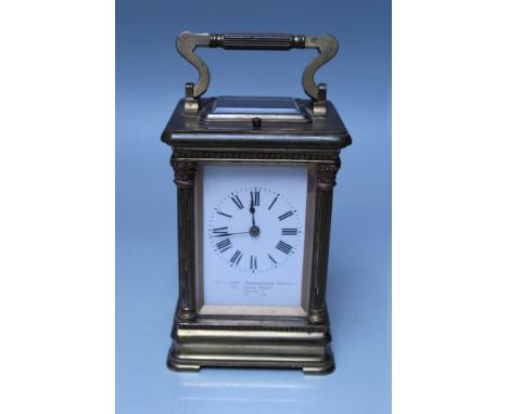 A FRENCH BRASS CASED REPEATER CARRIAGE CLOCK, the white enamel dial with Roman numerals and outer minute markers, retailers '