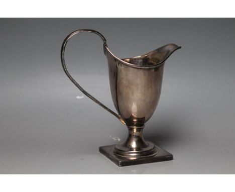 A BRITANNIA STANDARD SILVER HELMET CREAM JUG, of plain form on a squared silver base, carrying lion's head and Britannia stam