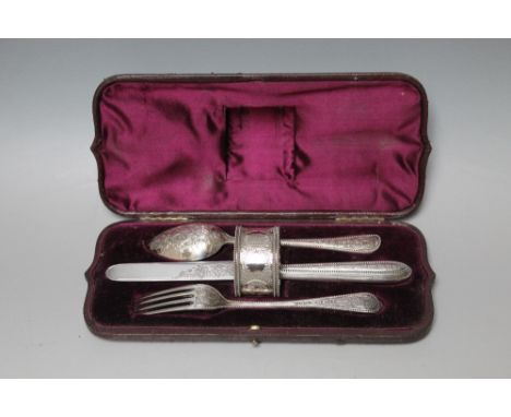 A CASED HALLMARKED SILVER CHRISTENING SET BY FREDERICK ELKINGTON - LONDON 1869, consisting of knife, fork, spoon and napkin r