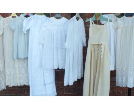 A COLLECTION OF EARLY 20TH CENTURY CHILDREN'S CLOTHING, to include a selection of christening gowns, day dresses, a pale blue