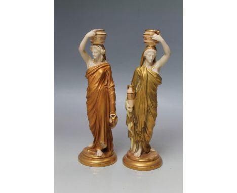 A PAIR OF ROYAL WORCESTER BLUSH IVORY FIGURES, ladies with Grecian urns, gilt detailing, H 24.5 cm  (2)