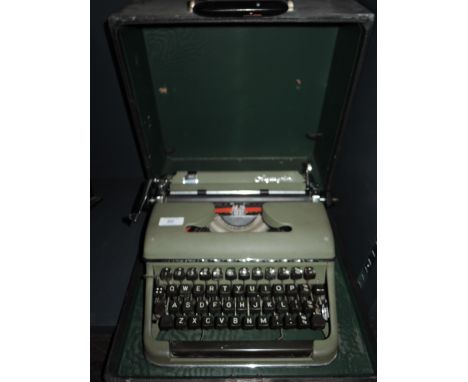 A vintage typewriter by Olympia in olive green
