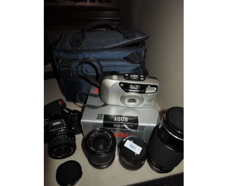 A Pentax Program A camera with Tokina 28mm, 80-200mm, 35-70mm and doubler in soft camera bag