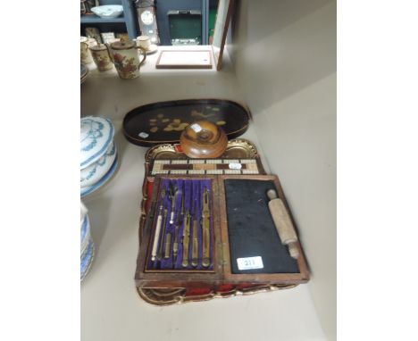 A miscellaneous selection including treen candlestick, geometry set in brass, cribbage, two trays