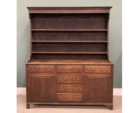 NORTH WALES OAK DRESSER circa 1840, wide boarded back three shelf rack, panel sided peg joined base, T arrangement of six ope