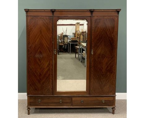 MAHOGANY TRIPLE WARDROBE circa 1900, capped pillar detail to the corners, walnut crossbanded quarter veneered doors, central 