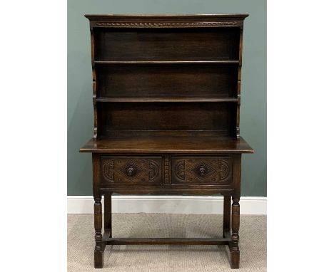 COMPACT REPRODUCTION OAK DRESSER, shape sided two-shelf rack, two deep drawers, carved detail, turned wooden knobs, turned an