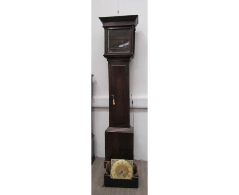 An 18th century longcase clock with 11 inch brass face, engraved with image of bird, basket of fruit and fish. The dial with 