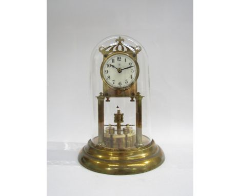 A 20th Century glass domed anniversary clock, made in Germany, raised on a stepped circular base with front turn columns and 