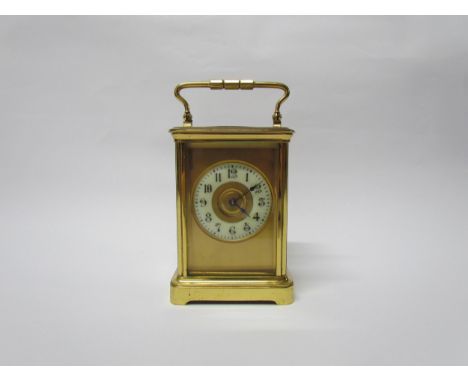 An early 20th Century brass cased carriage clock with 8-day movement striking on a gong. Arabic enamelled chapter ring. Swiss