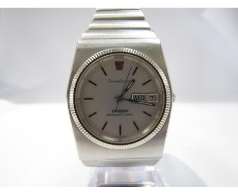 An Omega Constellation MegaQuartz 32khz bracelet watch, black dial with centre seconds and calendar, on Rado bracelet 