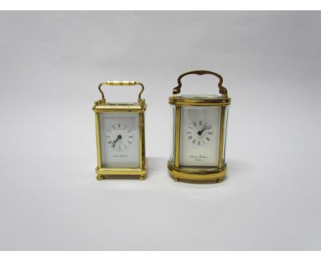 Two 20th Century miniature carriage timepieces, retailed by London Clock Co and Charles Frodsham (ovalised case) both with mo