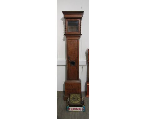 An 18th Century longcase clock with brass 10 inch square face, with unusual two train movement. The face with engraved cottag